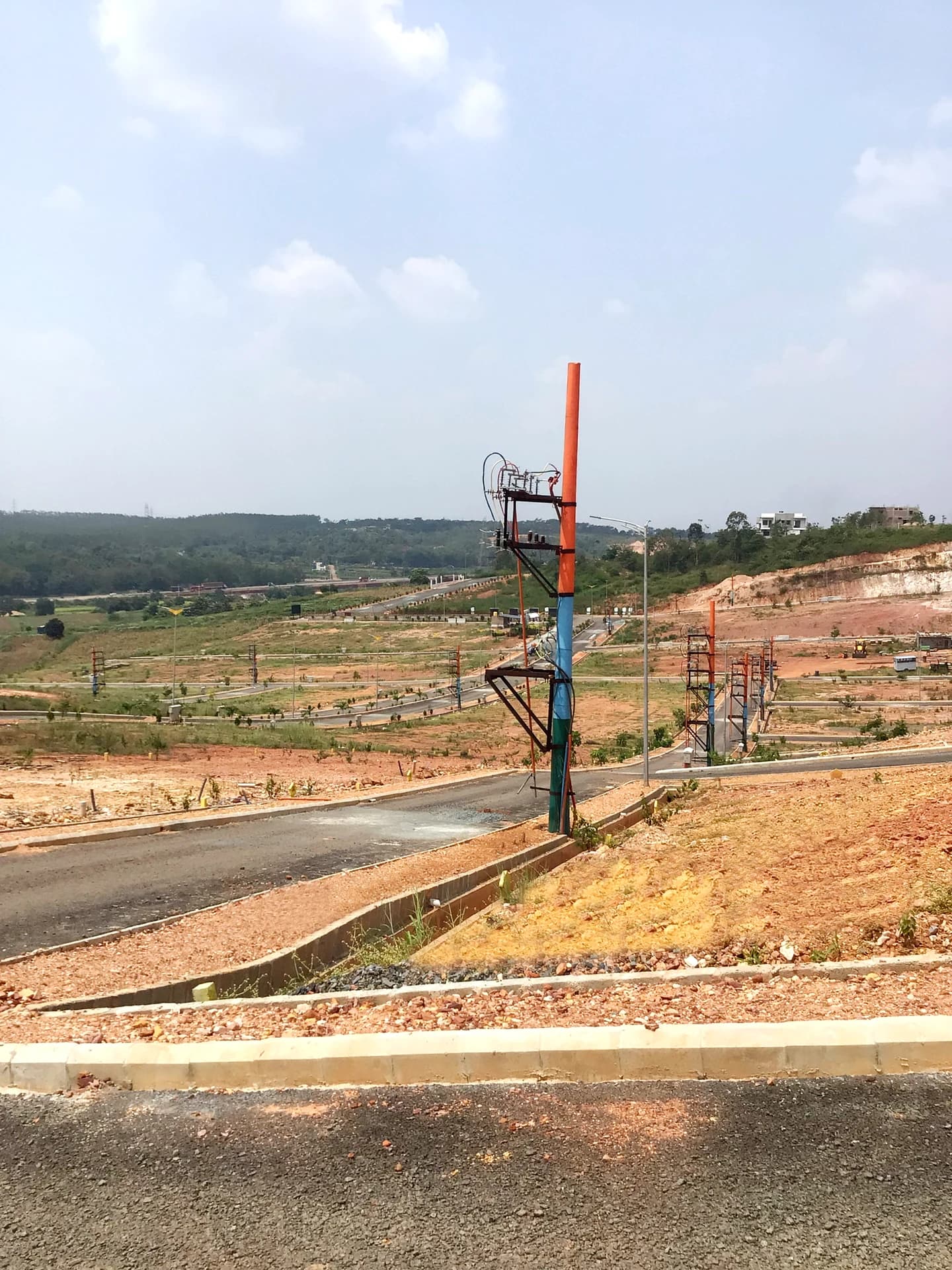 Panoramic Hillside Vista of Terraced Plots & Roads